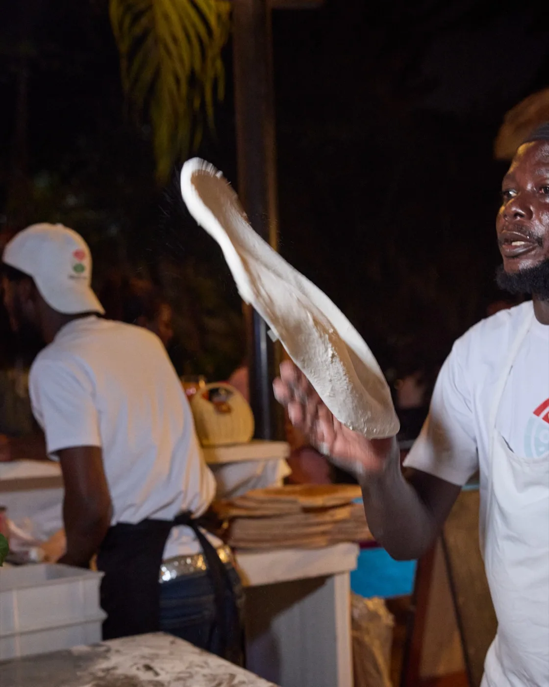 Chef tossing pizza dough